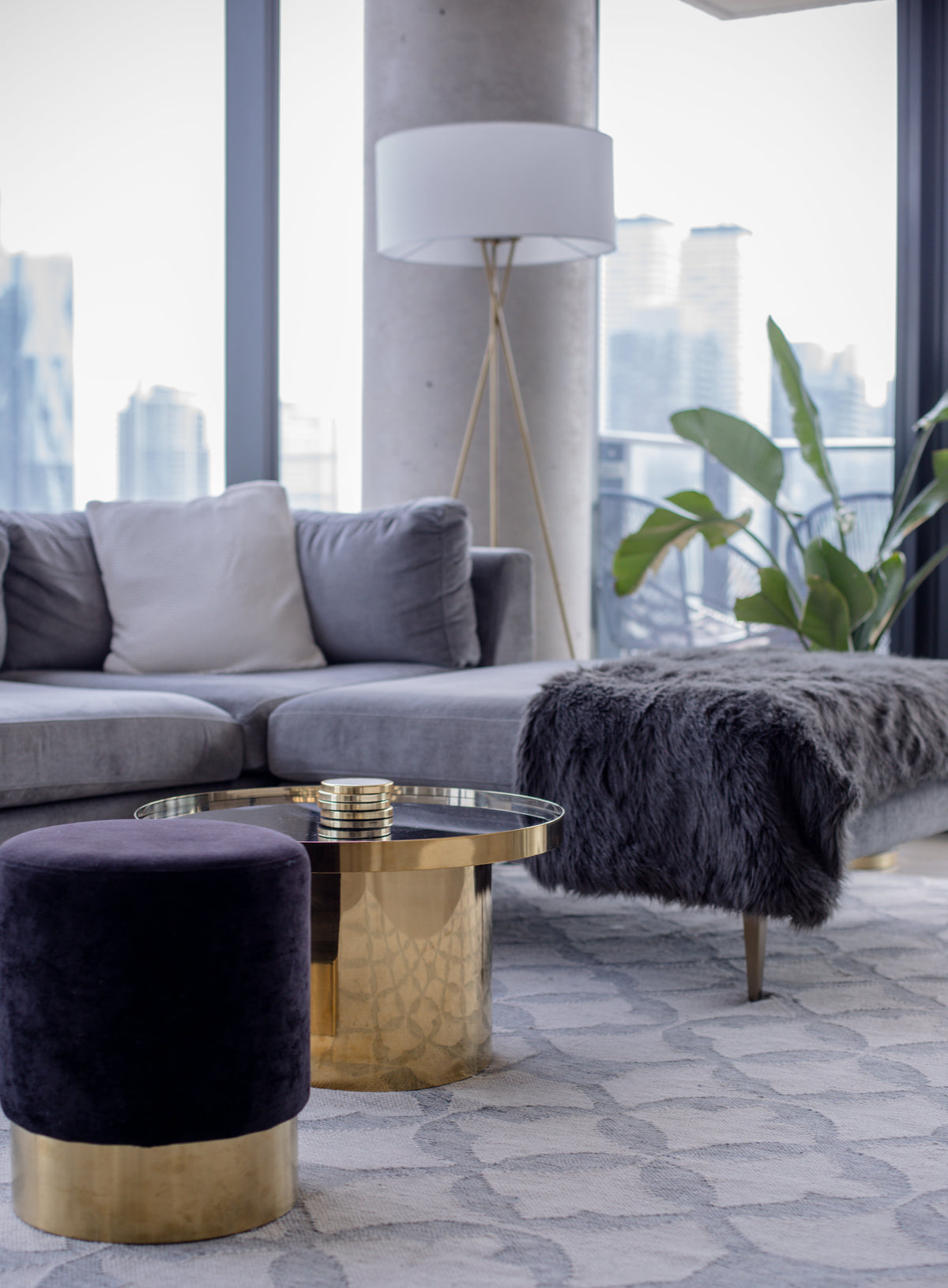 Modern living room with grey sofa and marble side table